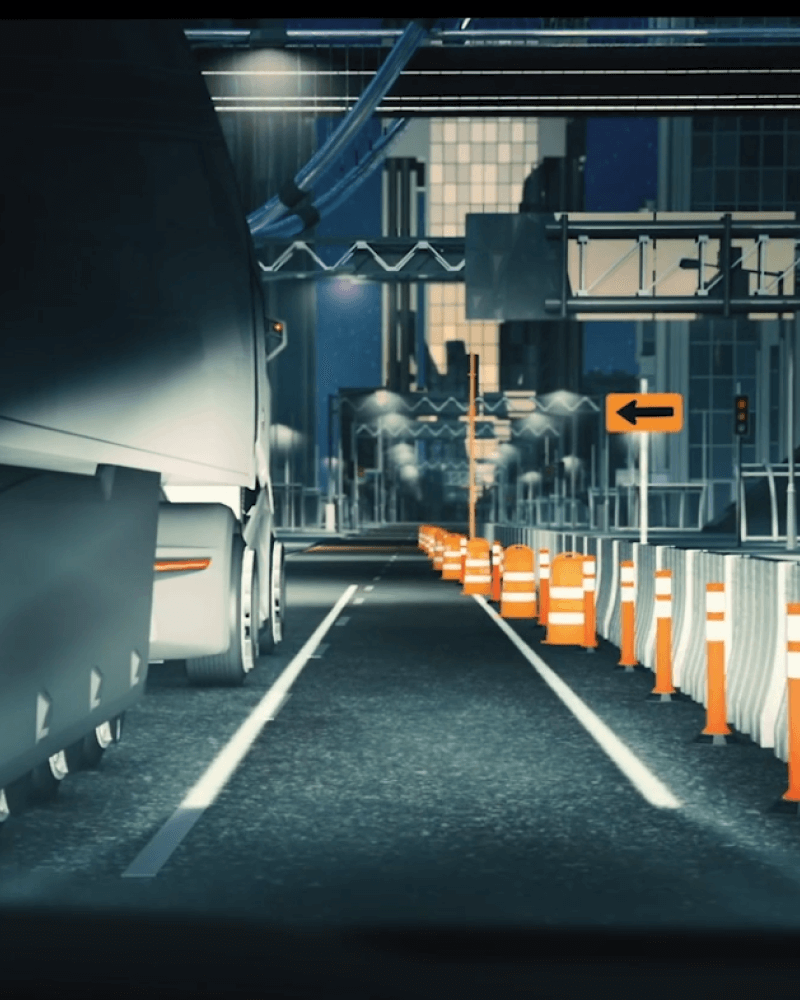 Headlights hitting a lorry and a lane closure to provide a warning to the driver