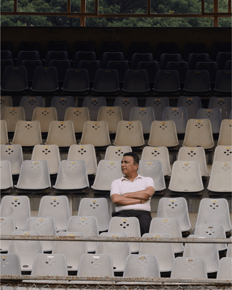 Sunil Gavaskar sitting in the criket stands